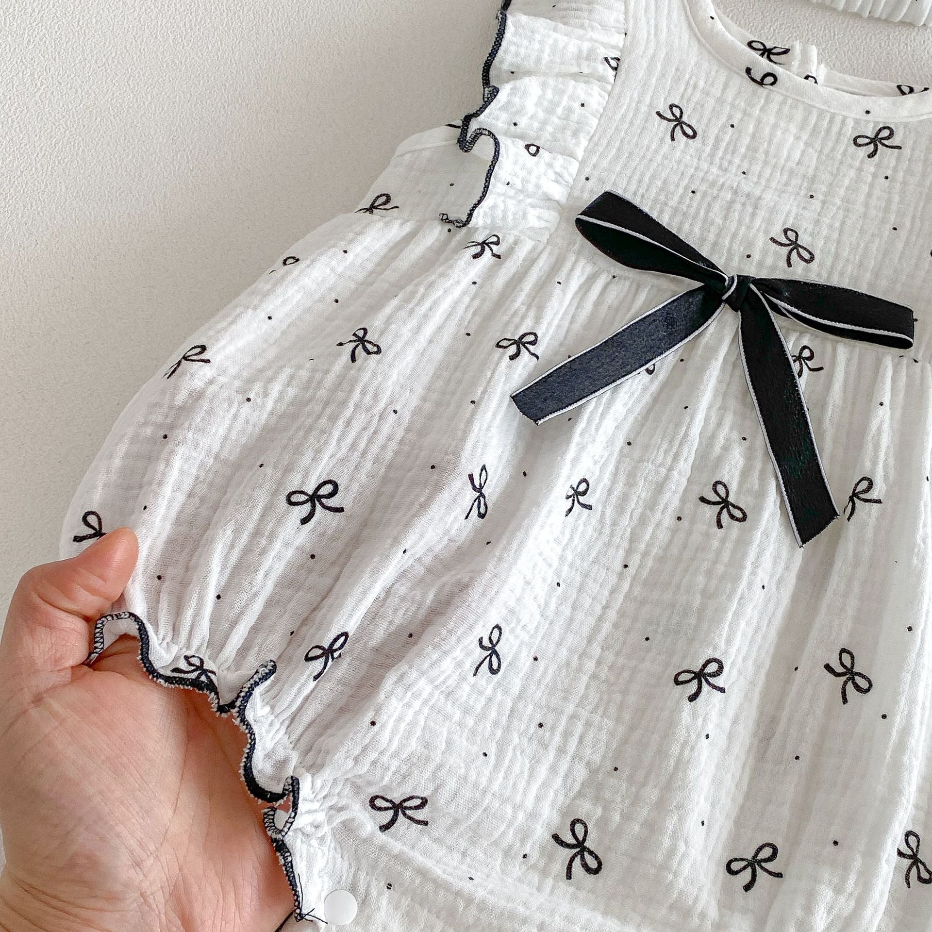 Ruffle Bow Pattern Onesie with Bow